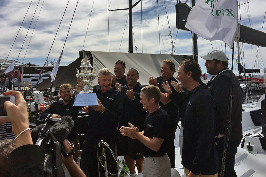 Balance owner and skipper Paul Clitheroe holds the Sydney to Hobart handicap winner's cup in 2015.
