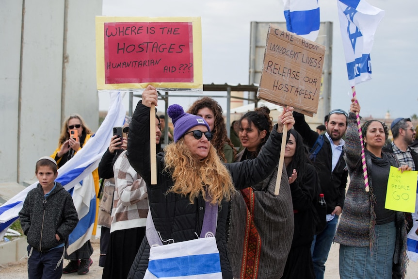 Protesters hold up sign calling for the release of hostages in Gaza. 