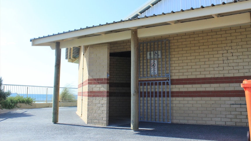 The exterior of a brick public toilet.