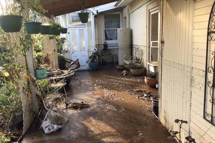 House in Latrobe with mudline showing how high the floodwater got