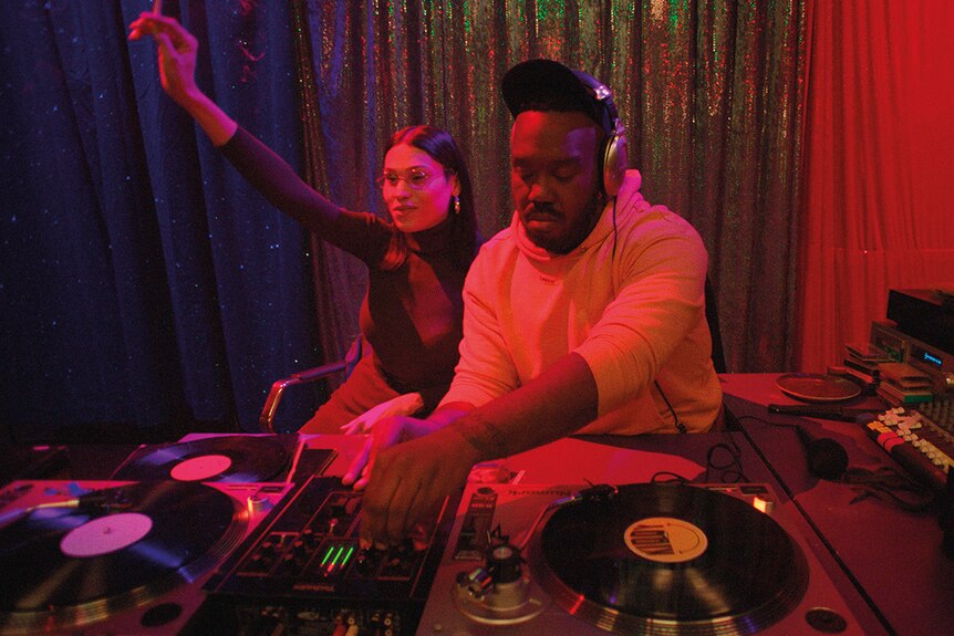 Colour still of Kiddy Smile DJing in 2018 film Climax.