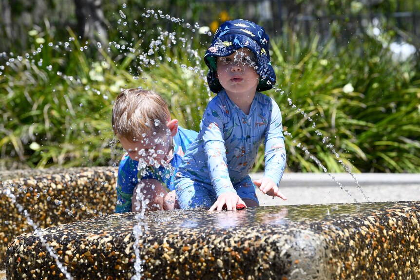 Children cool off at a water park in Yarrabilba, west of Brisbane,
