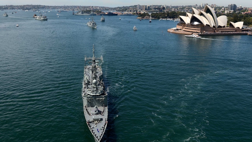 The Royal Australian Navy fleet makes its way along Sydney Harbour for the International Fleet Review.