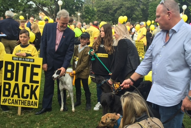 Greyhound breeders and trainers at a rally against a State Government ban.