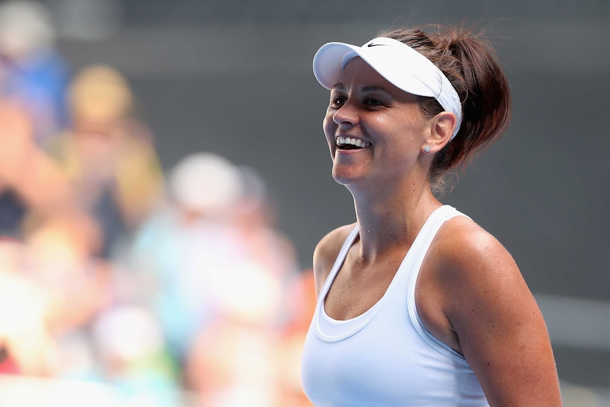 All smiles ... Casey Dellacqua celebrates her win over Kirsten Flipkens