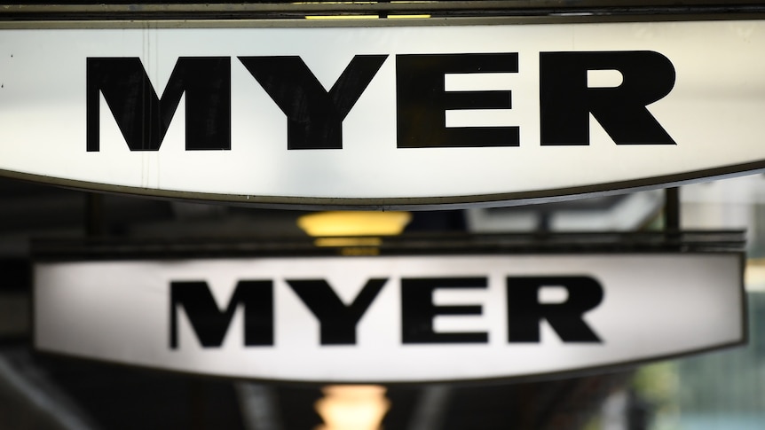 Two signes outside a shop that read "MYER"