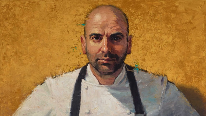 An oil on linen portrait of George Calombaris in a chef jacket and apron.