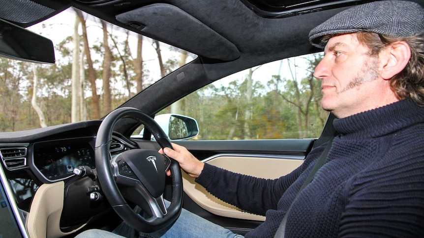 Davide Michielin at the wheel of his Tesla.