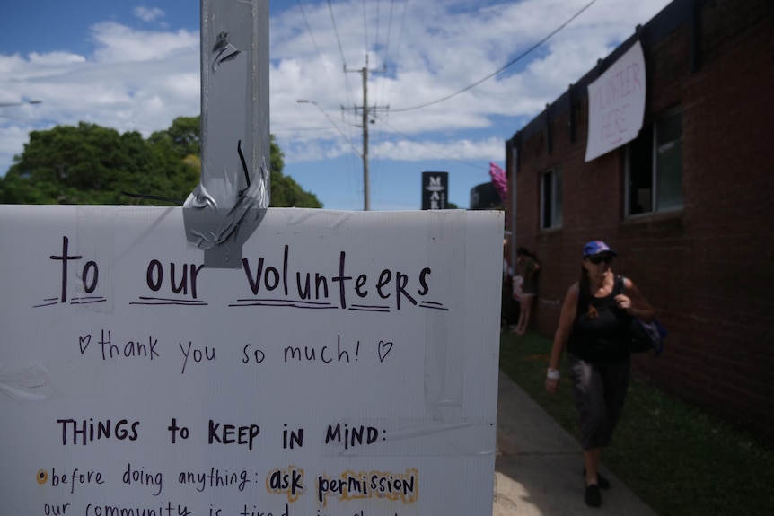 A makeshift sign on a post saying, 'to our volunteers, thank you so much. Things to keep in mind, before doing anything 