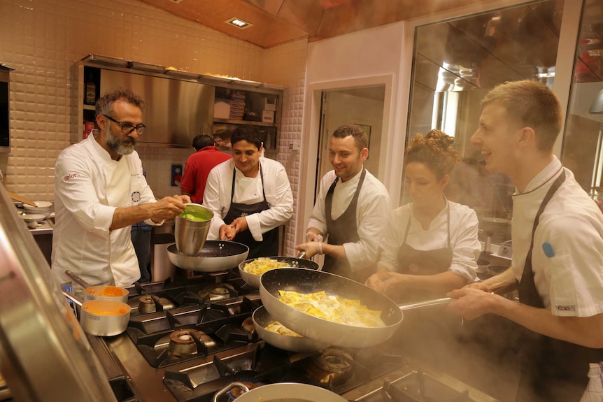 Massimo Bottura cooking in the kitchen