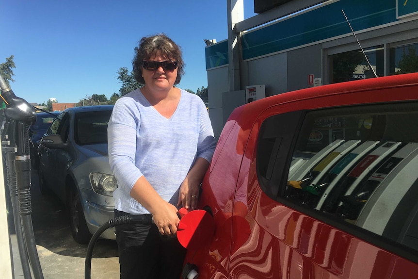 Shani Pemberton fills up her car.