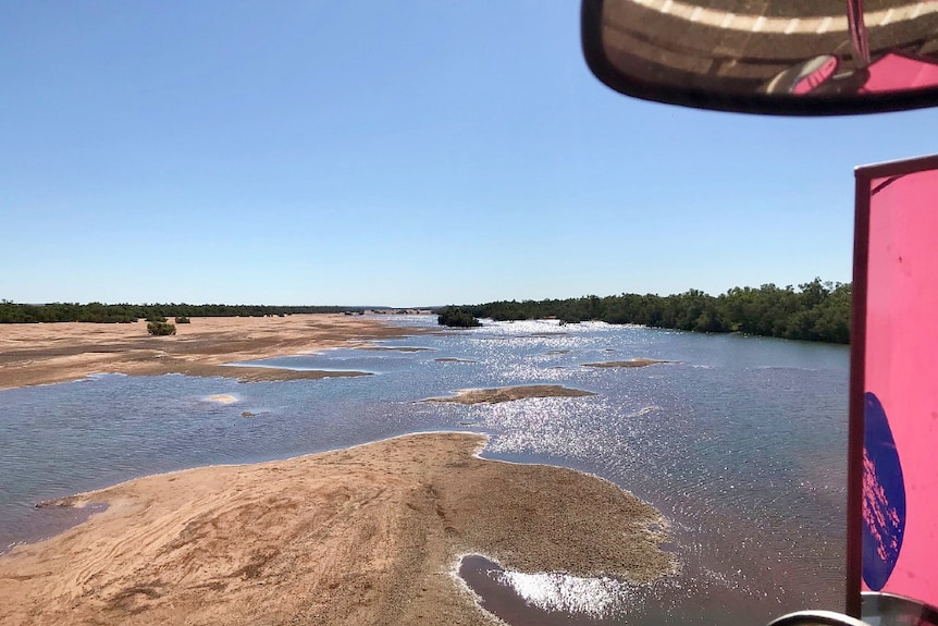 A shot of water in the De Grey River in the Pilbara taken from a moving truck.