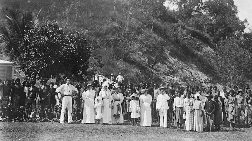 An old photo of Aboriginal people and white people posing for group photo