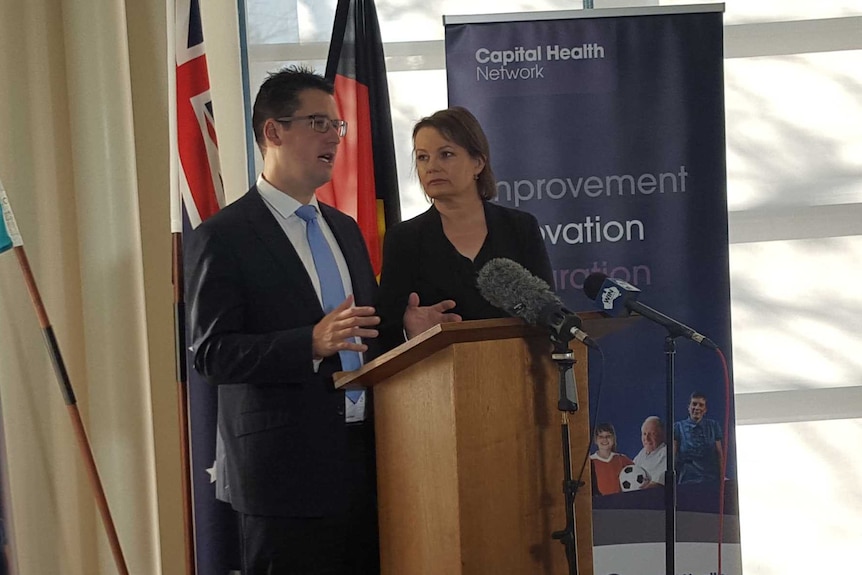 Senator Zed Seselja and Federal Health Minister Susan Ley stand before a press conference