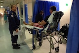 A man lies on a stretcher in Nepean Hospital's emergency department