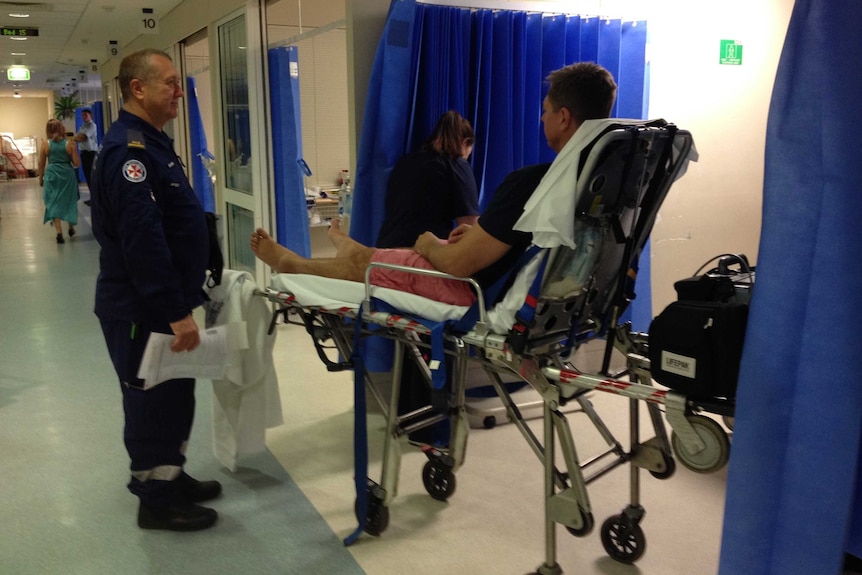 A man lies on a stretcher in Nepean Hospital's emergency department