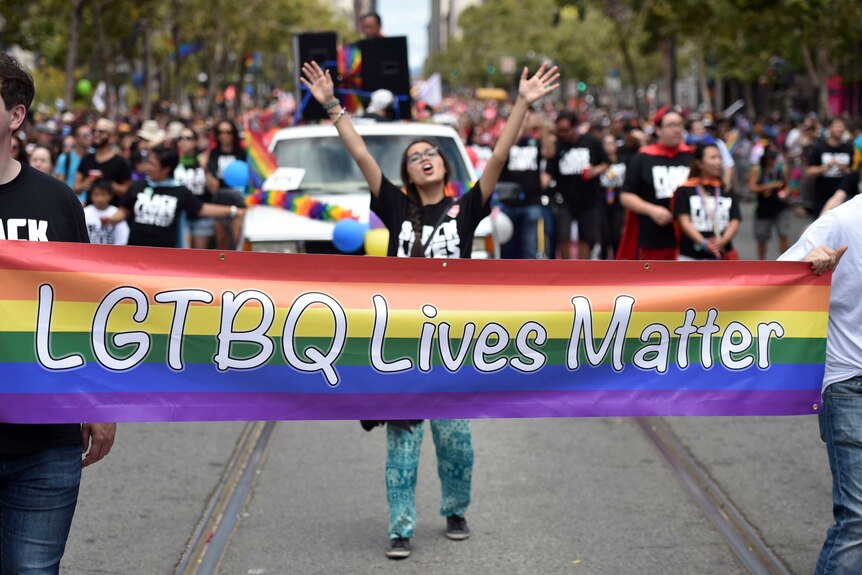 People march during a gay pride parade in San Francisco