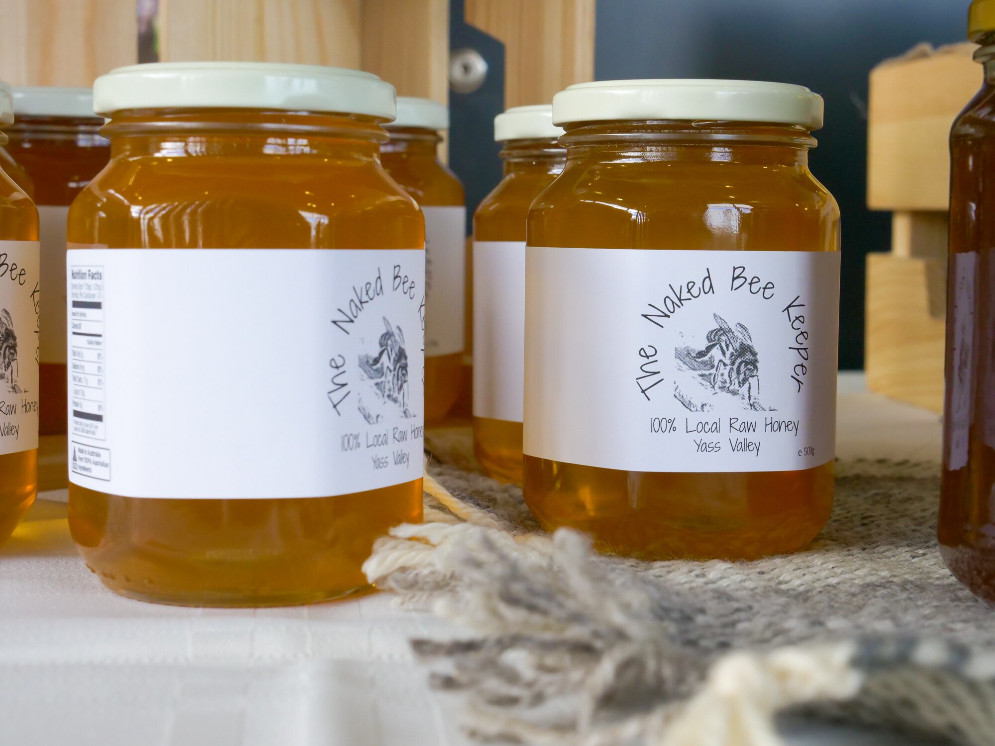 Jars of honey with a label that says 100 per cent raw honey from the Yass Valley. 