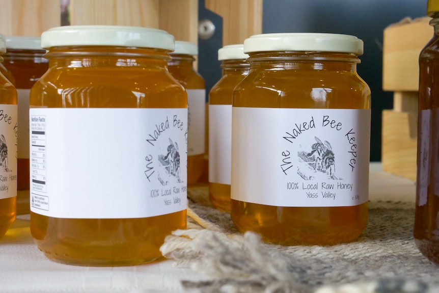 Jars of honey with a label that says 100 per cent raw honey from the Yass Valley. 