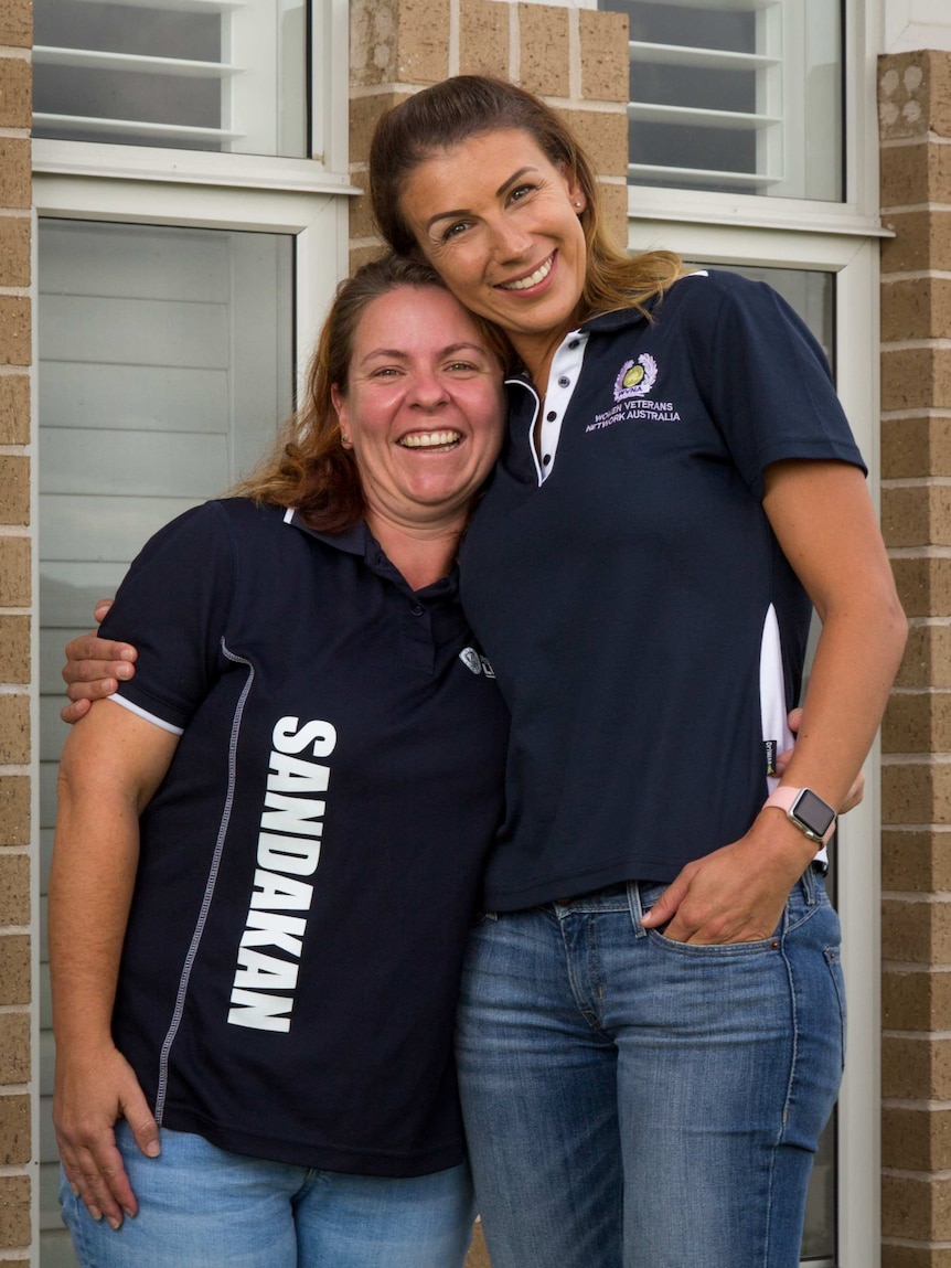 Rachel Kerrigan and Pennie Looker embrace.