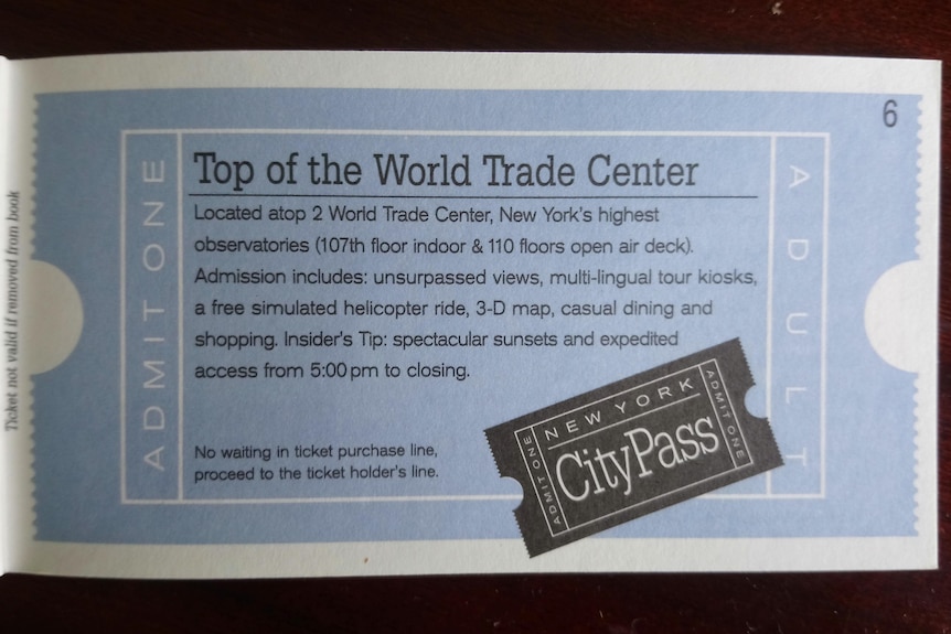 A blue ticket with the headline 'Top of the World Trade Center'