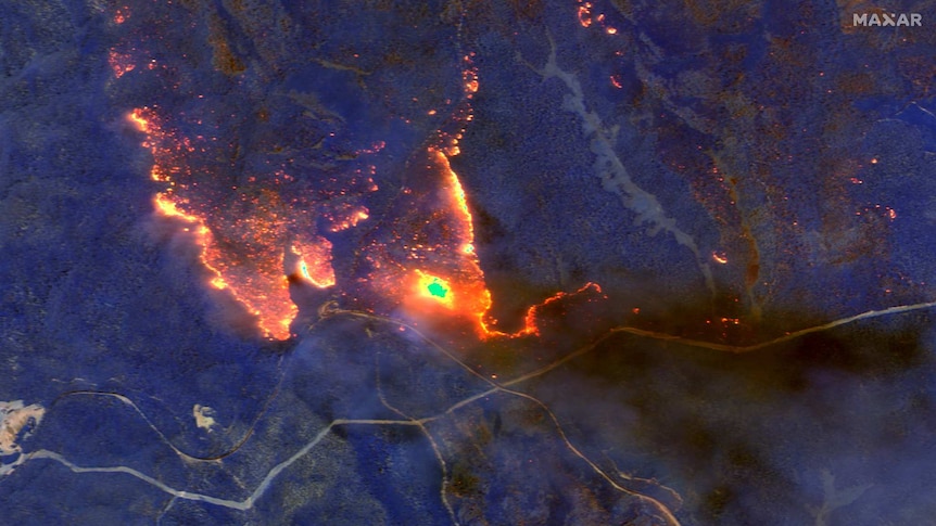 The same bushfire is seen in shortwave infrared (SWIR), with orange indicating active fire.
