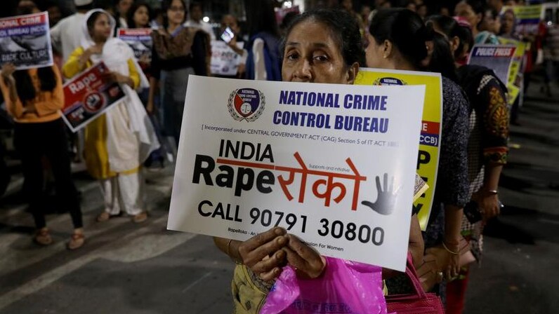 Woman marching against rape in India.