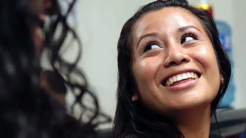 Evelyn Hernandez, 21, smiles in court after being acquitted.