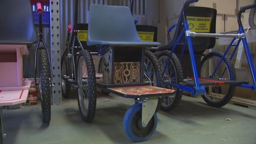 Gold Coast volunteers convert old bicycles into wheelchairs for disabled children