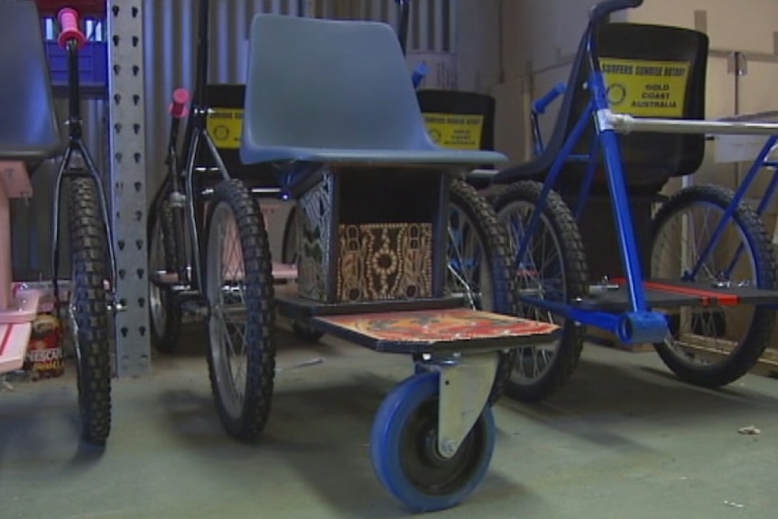 Gold Coast volunteers convert old bicycles into wheelchairs for disabled children