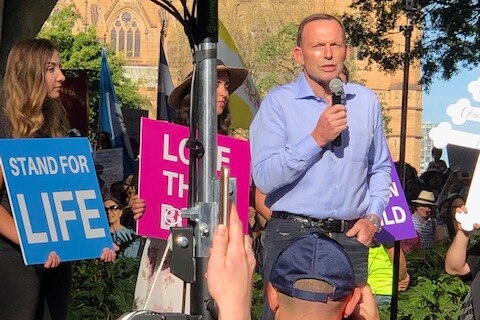 Tony Abbott speaking on stage