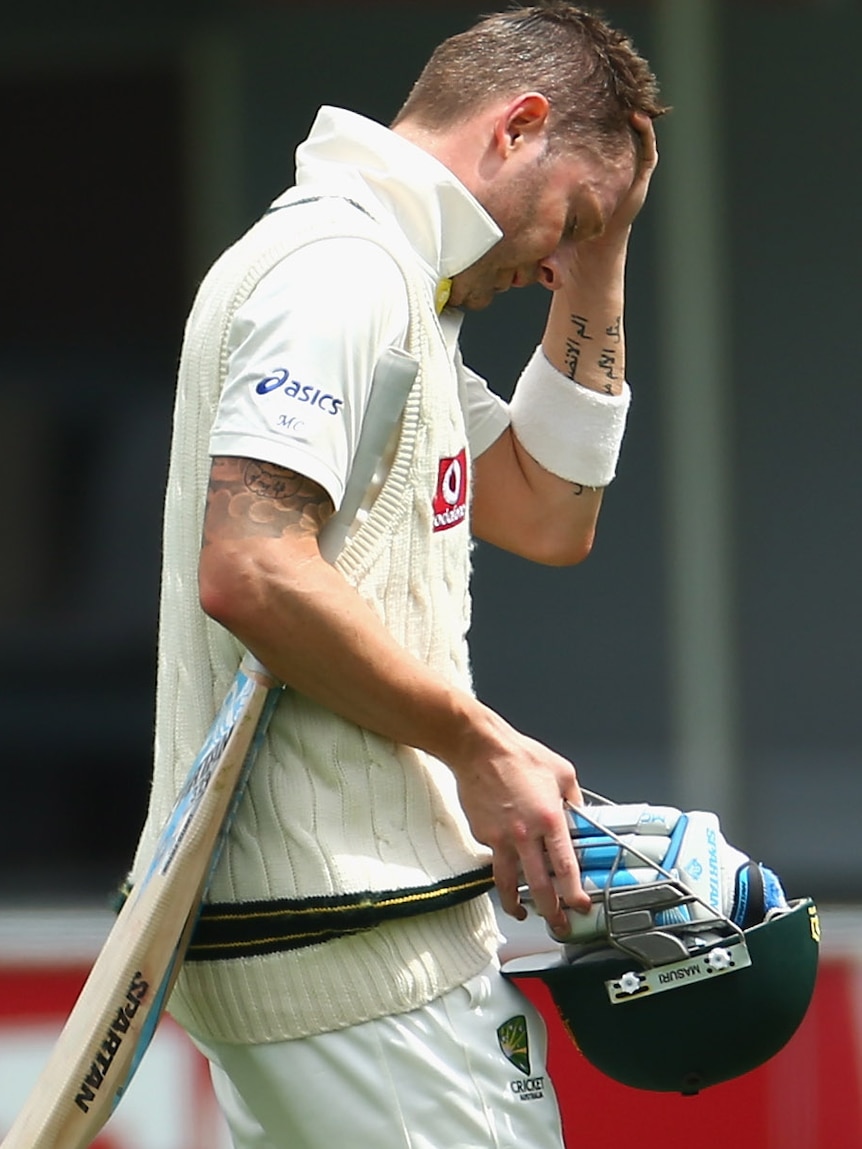 Big blow... Michael Clarke leaves the field with a right hamstring strain.