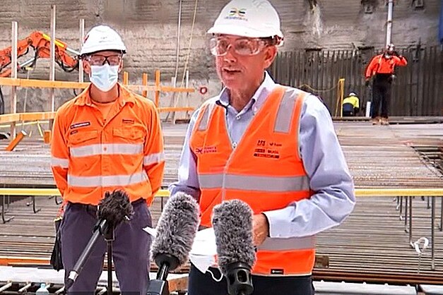 Queensland Treasurer Cameron Dick in a high vis vest at the Cross River Rail site