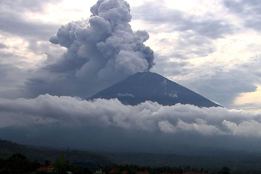 Plumes of smoke comes from the top of Mt Agung.