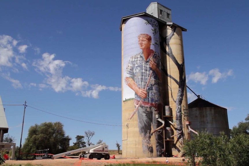 A mural by Fintan Magee of farmer Nick Hulland, painted on the Patchewollock silos.