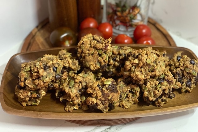 Muesli balls on a dish on a kitchen bench