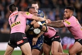 A man is tackled during an NRL match