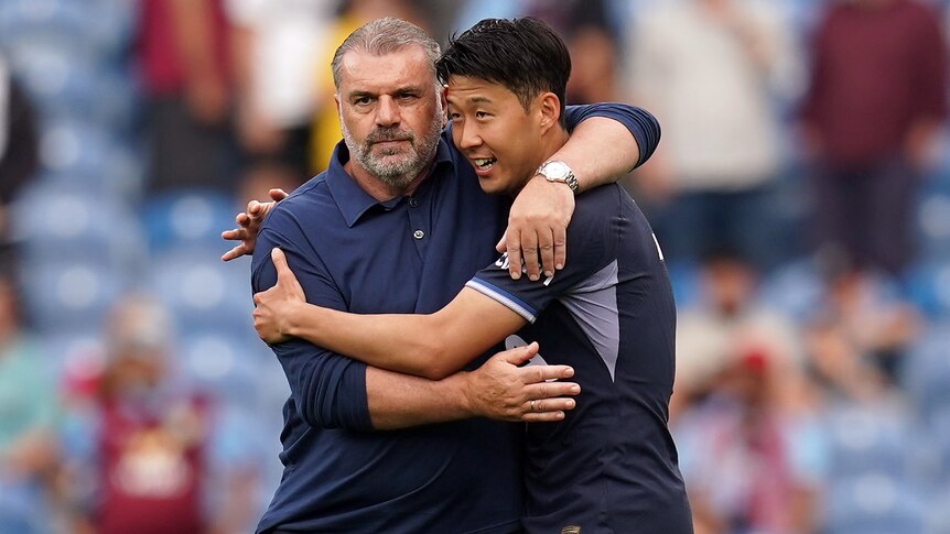 Tottenham Hotspur manager Ange Postecoglou puts his arm around captain Son Heung-Min.