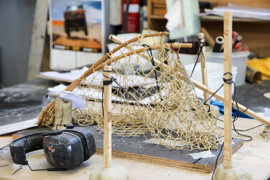 A model of a fishing net in a workshop.