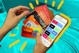 Woman holds credit and rewards cards and a phone with a reward cards app on the screen for a story about loyalty programs.