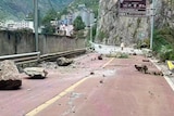 fallen rocks are seen on a road near Lengqi Town in Luding County of southwest China's Sichuan Province.