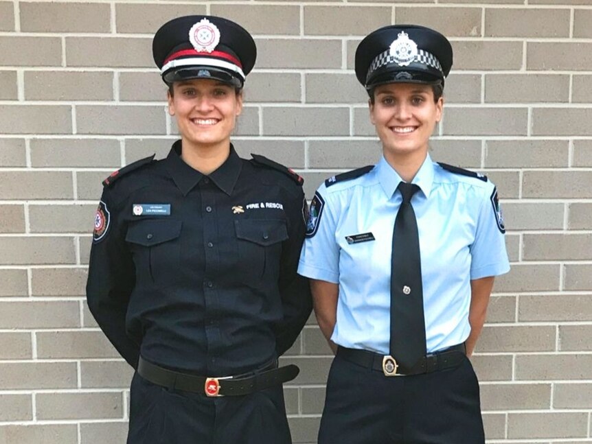 Twin sisters in emergency services uniforms.