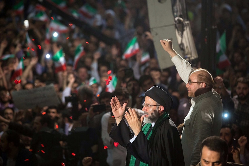 Iranian presidential candidate Ebrahim Raisi with Tehran Mayor Mohammad Baqer Qalibaf during a campaign meeting.