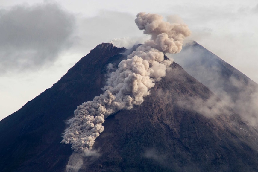 Hot cloud of volcanic materials run down the slope of Mount Merapi.