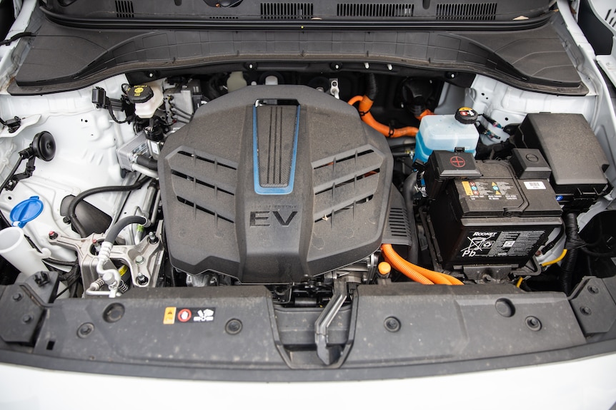 A battery under the hood of an electric vehicle.