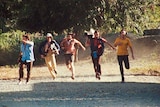 The Balibo Five run from the Indonesian Army in a scene from the movie Balibo