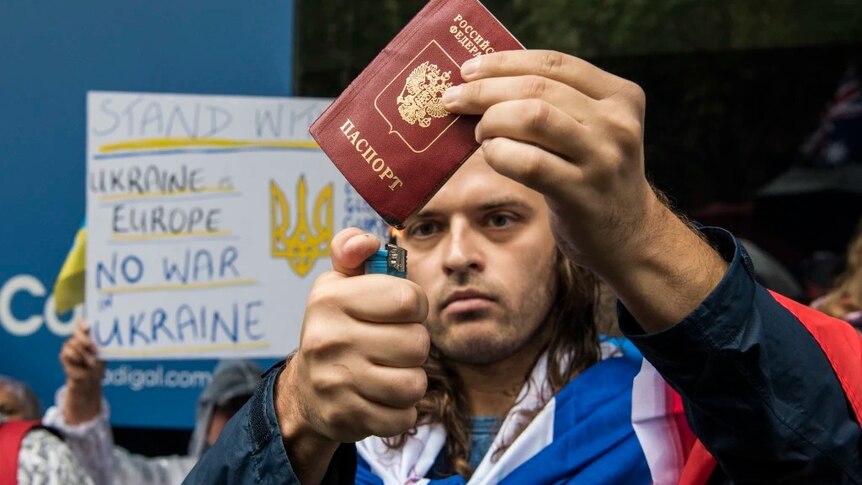 Russian Australian Ilya Fomin burns Russian Federation passport (Feb 2022)
