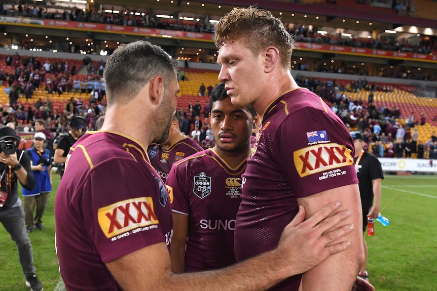 Cameron Smith consoles Dylan Napa and Anthony Milford