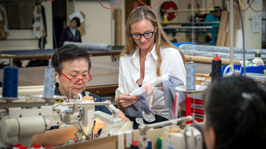 Alexia Spalding with a worker sewing