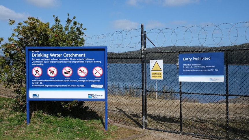 A large dam with a sign saying "drinking water catchment".